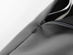 Macro shot of grey fabric texture and high-quality invisible zipper on a mini skirt