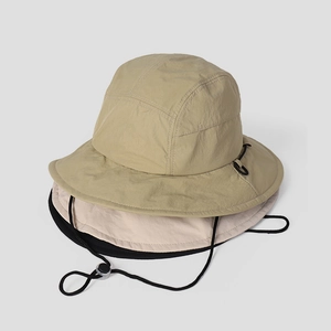 Detail of three quick-dry outdoor hats with adjustable drawstring in khaki and black
