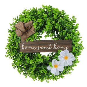 Artificial boxwood Christmas wreath with white daisies, burlap bow and home sweet home sign