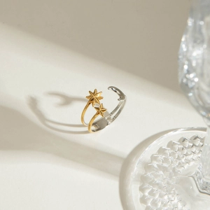 Two-tone celestial star and moon open ring in gold and silver finish on elegant glass