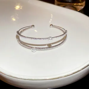 Double-layered open cuff bracelet with micro-pave zircons and two white pearls for women