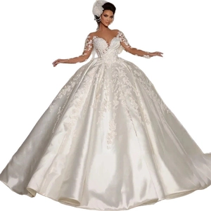 Elegant long sleeve ball gown wedding dress with lace embroidery and cathedral train