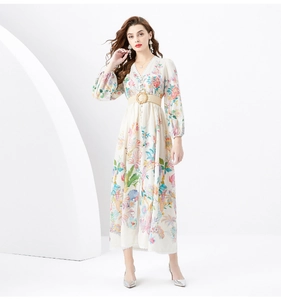 Detail of V-neck lace maxi dress with floral bird print and woven buckle belt