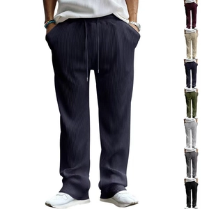 Detail shot of vertical striped texture on men's navy loose fit casual straight pants