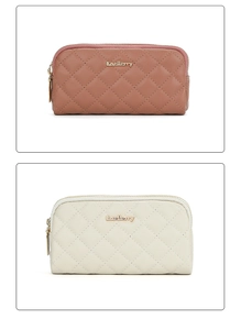 Detail of quilted long clutch wallets in dusty pink and cream white with gold hardware