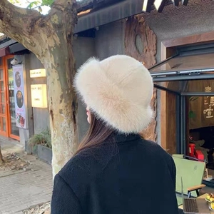 Women's cream white faux fur bucket hat with thick plush texture for winter warmth