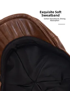 Detail of brown leather newsboy cap showing soft cotton sweatband and premium inner lining