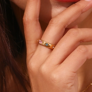 Detailed macro view of 18K gold plated ring with colorful zircons and star engraving