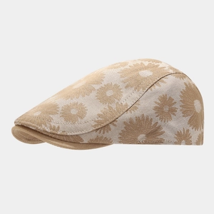 Side view of a khaki newsboy cap featuring detailed sunflower prints and soft fabric texture