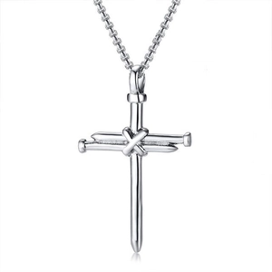Detailed close-up of polished silver nail cross pendant with intricate center wire wrapping