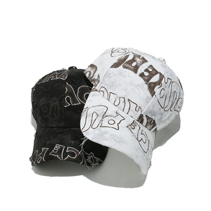 Distressed baseball caps with all-over letter print in black and white set