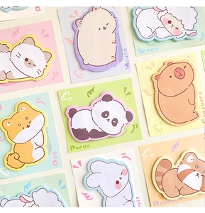 Flat lay view of cute cartoon animal sticky notes featuring panda rabbit and sheep designs