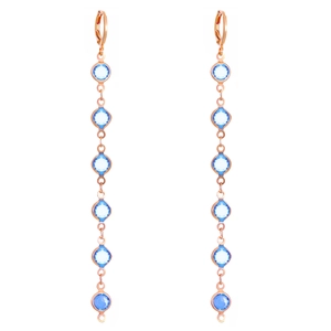 Long rose gold drop earrings featuring vertically linked light and dark blue crystals