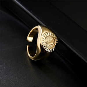 Adjustable 18K gold-plated signet ring with embossed letter L on textured coin surface