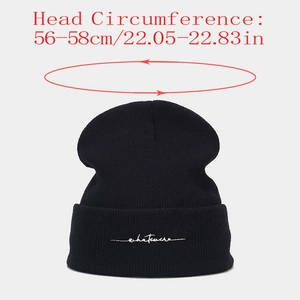 Detail of black beanie with whatever embroidery showing 56-58cm head size circumference