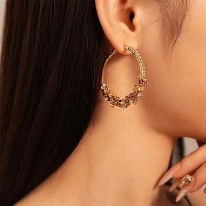 Chic gold hoop earrings with sparkling rhinestones and metal cluster detail for women