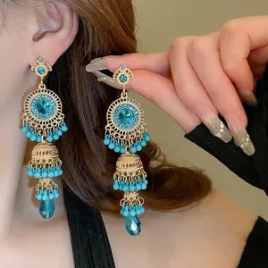 Vintage bohemian tassel drop earrings with blue beads and golden antique finish