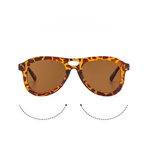 Close-up of tortoise shell pilot sunglasses with double bridge and dark lenses