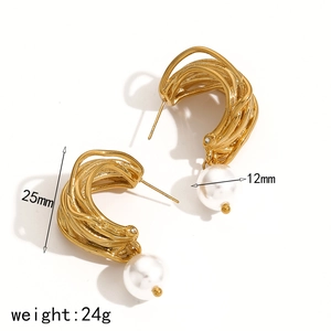 Golden C-shaped twisted texture earrings with white pearl detail on white background