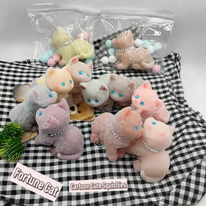 Macro shot of assorted colorful flocked cat squeeze toys in transparent gift packaging