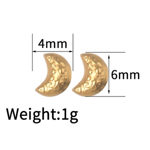 Detail of 18K gold stainless steel crescent earrings with moon texture and dimensions