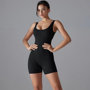 Detail of black V-back yoga bodysuit with seamless compression and scoop neckline