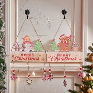 Christmas wooden gingerbread man and gnome signs hanging on wall with red snowflakes
