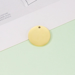 Polished gold circular metal pet tag with small hanging hole and smooth finish