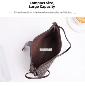 Interior view of monogram printed crossbody bag showing large main compartment capacity