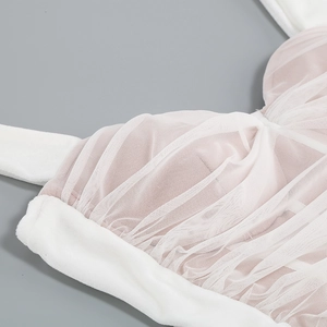 Close-up of velvet mesh bodice with heart neckline detailing and fine stitching