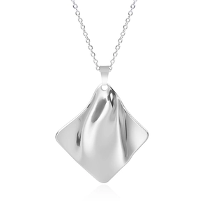 Macro detail of silver diamond-shaped pendant with ripple texture on polished steel chain