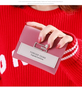 Pink and beige bi-color short wallet for women featuring a silver square metal buckle
