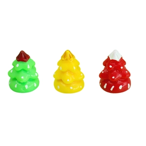 Miniature resin Christmas trees in green, yellow, and red with snowy polka dot details