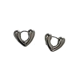 Polished silver heart shaped hoop earrings in minimalist 3D hollow design for women