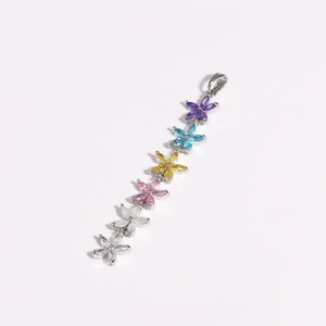 Vertical row of multi-colored zircon flower charms on a long tassel pendant necklace