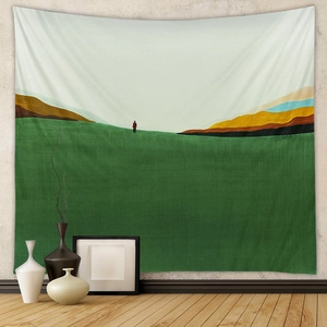 Detail of bohemian tapestry featuring abstract landscape with green hills and clear texture