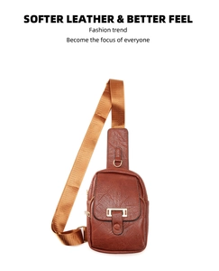 Macro shot of brown leather texture and golden metal hardware on a casual sling bag