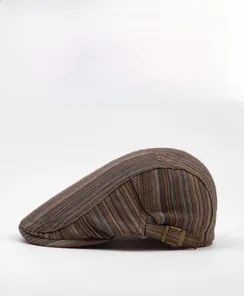 Detail view of colorful striped flat cap side profile with vintage metal buckle