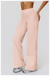 Detail view of high-waisted pale pink wide-leg sports pants with seamless waistband