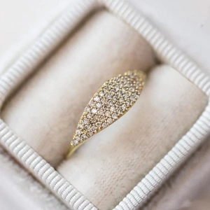 French minimalist gold ring with pavé-set crystals in a marquise-shaped design