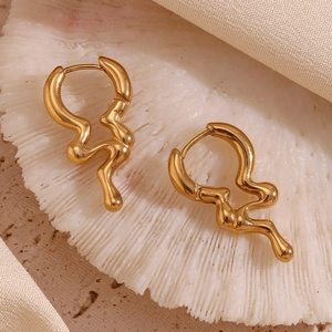 Macro view of irregular wavy liquid 18K gold plated stainless steel hoop earrings