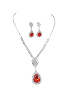 Detail of pear-shaped red crystal necklace and earrings set with brilliant rhinestones