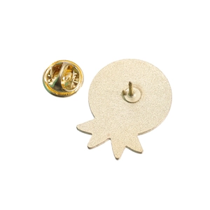 Detailed back view of golden metal medal brooch showing the butterfly clutch pin fastener