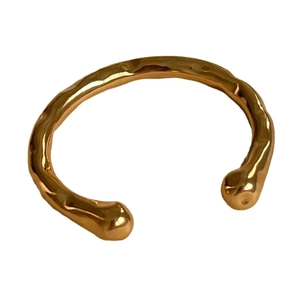 Bracciale rigido aperto in acciaio inossidabile placcato oro 18K con trama lavica fluida
