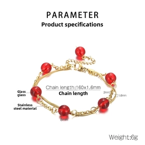 Detail of 1.6mm snake chain and 8mm red glass beads on a gold stainless steel bracelet