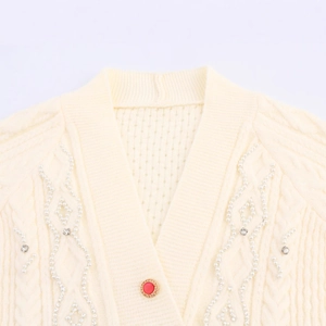 Women's V-neck knit cardigan with cable knit patterns, pearls and rhinestone details