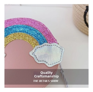 Detail of colorful sequins rainbow and iridescent cloud patch on pink children purse