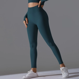 Detail of high-waisted seamless yoga set in dark teal with wide tummy control waistband