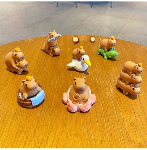 Set of seven creative capybara resin figurines in various fun poses for desk decoration