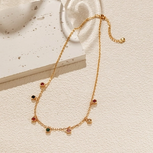 Detail of 18K gold plated chain with colorful round zircon stones and adjustable clasp